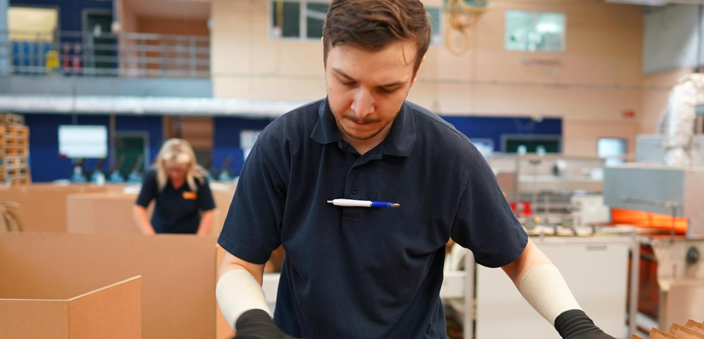 Guy looking through boxes