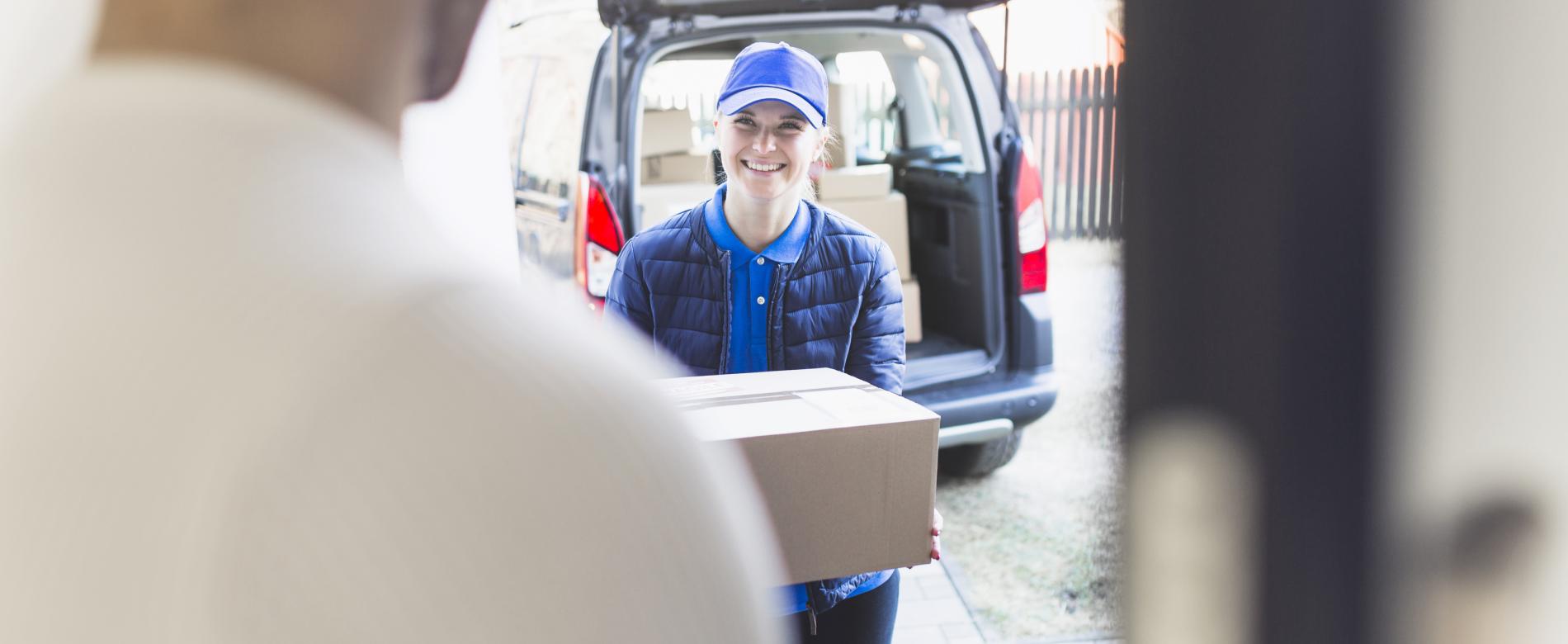 Delivery-girl-carrying-box-customer