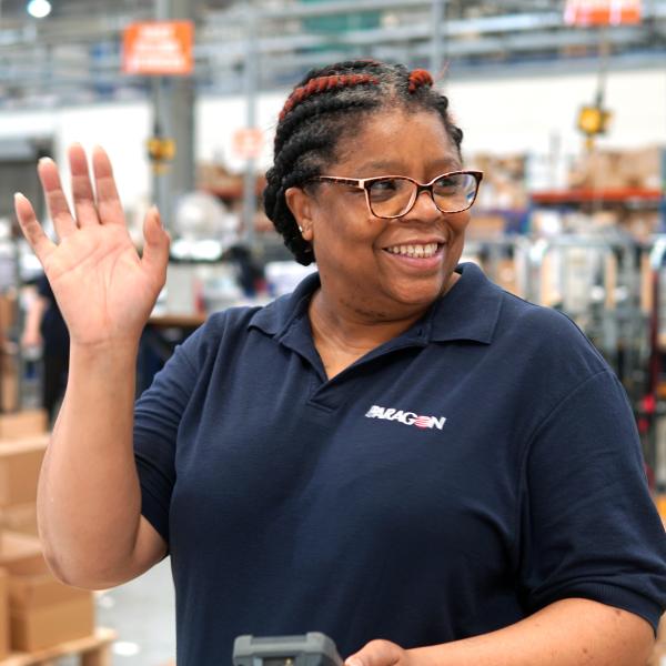 Paragon employee waving and smiling