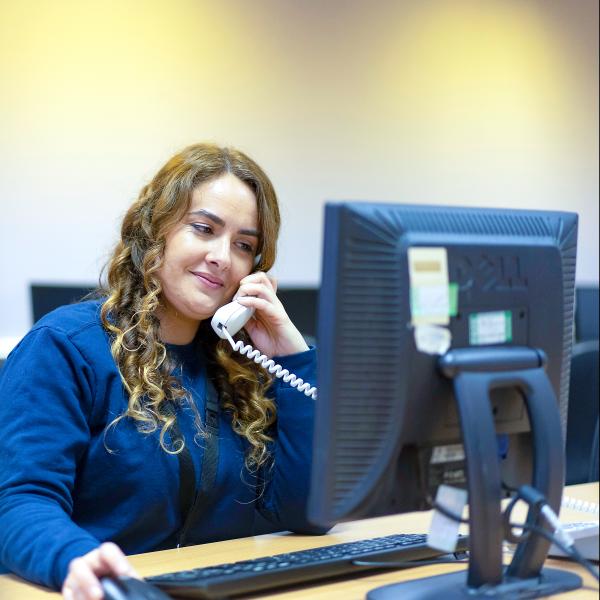 Woman on telephone call at desk
