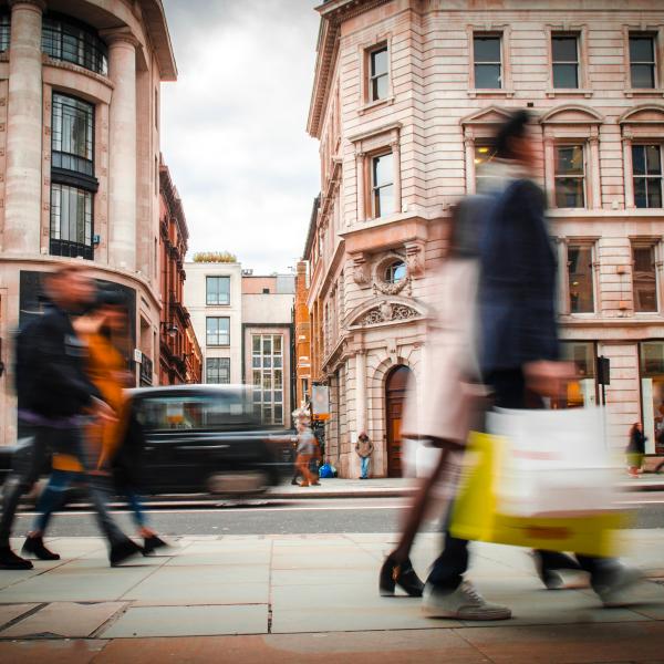 Abstract image of people walking along high street 