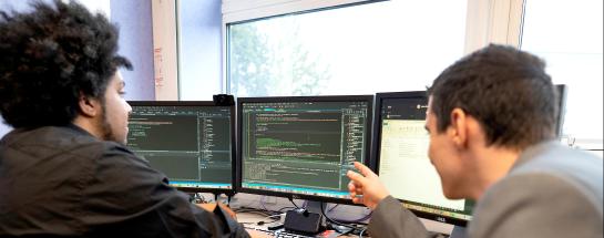 Two men at a computer