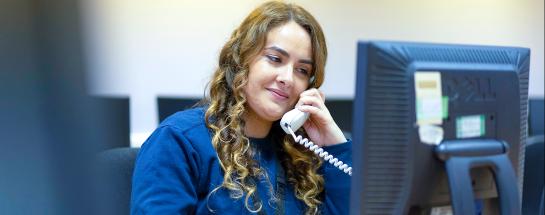 Woman on telephone call at desk